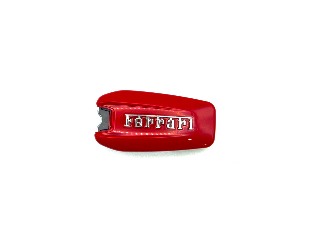 Red Ferrari key fob cover on a white background front on